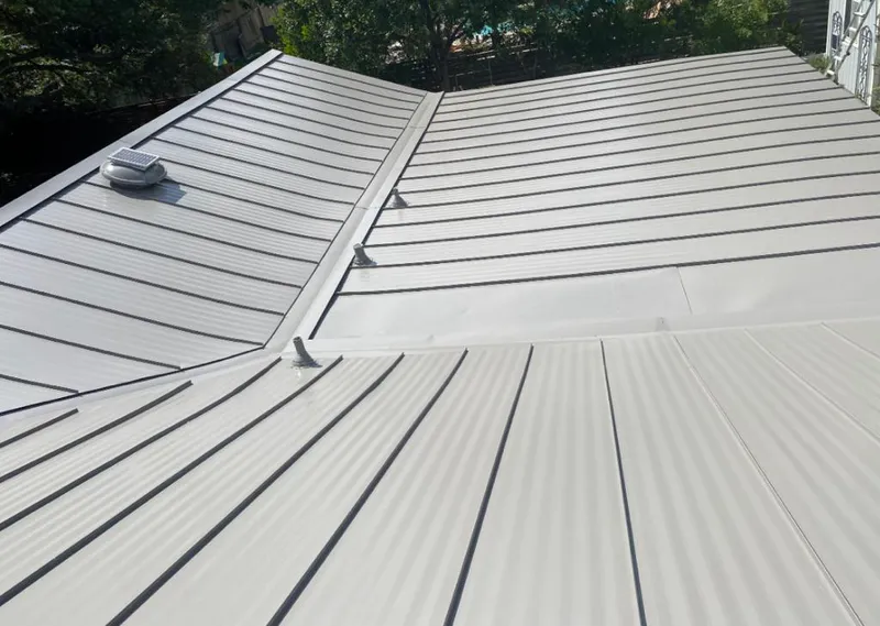 Solar attic fan installed on a metal roof for Roof Ventilation in New Port Richey